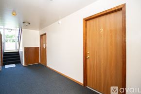 Rossford apartment for rent - A room with a door numbered 2 and a staircase.