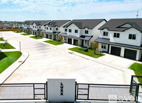 Edinburg apartment for rent - A row of houses with a sign that says "LUXE" in front of them.