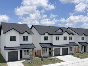 Edinburg townhouse for rent - A row of modern houses with black roofs and white walls.