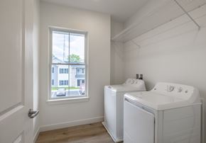 Carlisle apartment for rent - A laundry room with a washer and dryer and a window.