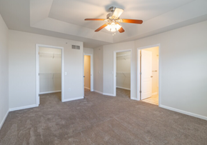 Harrisburg townhouse for rent - A room with a ceiling fan and carpeted floor.