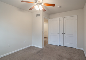 Harrisburg townhouse for rent - A room with a ceiling fan and two doors.