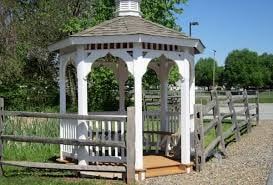 Middletown apartment for rent - A white gazebo with a brown roof is surrounded by a wooden fence.