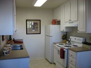 Antioch apartment for rent - A kitchen with white appliances and cabinets.