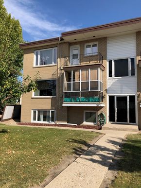 Swift Current apartment for rent - A two-story apartment building with a balcony on the second floor.