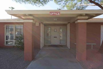 Phoenix apartment for rent - A building with a red sign that says "OFFICE" on top.