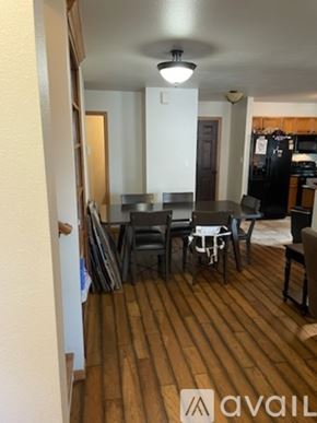 Sheridan townhouse for rent - A dining room with a table and chairs.