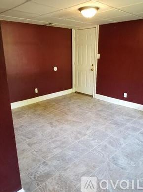 Lawrenceville apartment for rent - A room with a white door and a tiled floor.