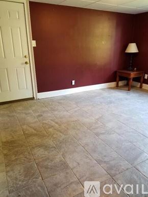 Lawrenceville apartment for rent - A room with a brown wall and a white door.