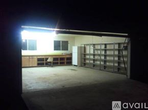 Visalia apartment for rent - A dark room with a light on and a white wall.