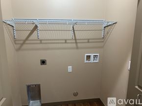 Helena apartment for rent - A metal shelf bracket is mounted on a wall.