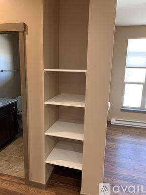 Helena apartment for rent - Empty shelves in a room with a doorway leading to another room.