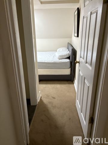 North Little Rock apartment for rent - A small bedroom with a bed and a door.