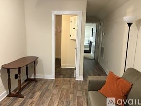 North Little Rock apartment for rent - A room with a brown table and a grey couch.