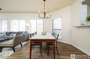 Euless house for rent - A dining room with a wooden table and chairs.
