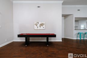 Dallas house for rent - A pool table in a room with a world map on the wall.