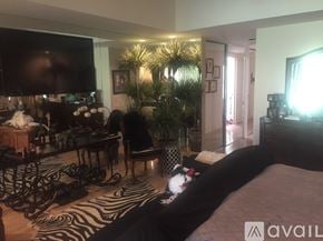 Rancho Mirage condo for rent - A bedroom with a zebra print rug and a large bed.