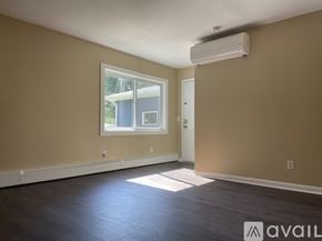 Madison apartment for rent - A room with a window, a door, and a wall-mounted air conditioner.