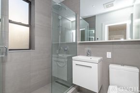 Boston apartment for rent - A modern kitchen with stainless steel appliances and wooden floors.