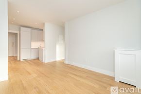 Boston apartment for rent - A bathroom with a toilet, sink, and walk-in shower.