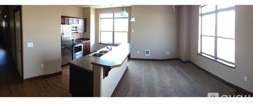 Helena apartment for rent - A kitchen with a refrigerator, sink, and a window.