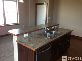 Helena apartment for rent - A kitchen with granite countertops and stainless steel appliances.