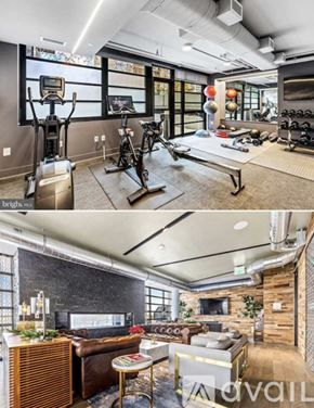 Washington condo for rent - A modern home gym with a treadmill, exercise bike, and other equipment.