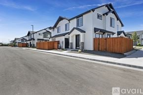 Boise townhouse for rent - A row of houses with a clear blue sky above them.