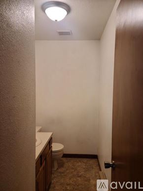 Billings townhouse for rent - A bathroom with a toilet and a sink.