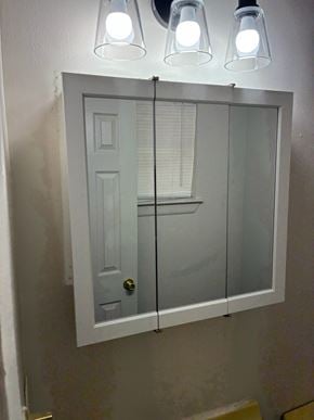 Morgan's Point Resort house for rent - A white door with a glass window is flanked by two lights.
