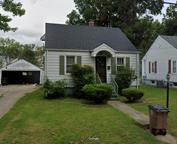 Cape Girardeau house for rent - A small house with a grey roof and a white garage door.