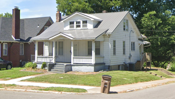 Cape Girardeau house for rent - A white house with a grey roof and a chimney.