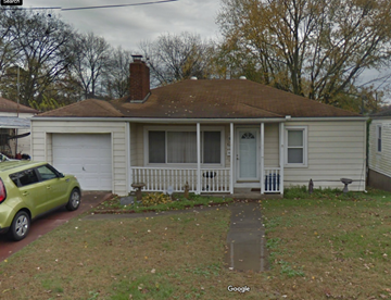 Cape Girardeau house for rent - A green car is parked in front of a house.