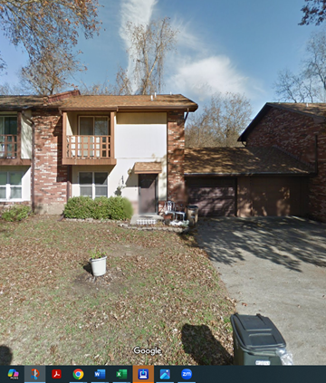Cape Girardeau house for rent - A Google image of a house with a brown roof and a white garage door.