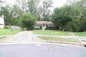 West Springfield house for rent - A residential area with a house and trees.