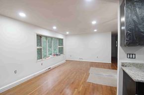 West Springfield house for rent - A room with wooden floors and a window.