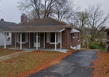 Cape Girardeau house for rent - A house with a driveway and a tree in the background.