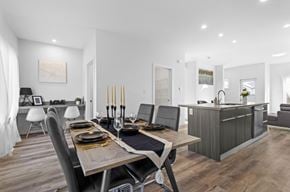 Edmonton apartment for rent - A modern dining room with a wooden table set for two.