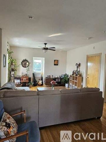 Philadelphia apartment for rent - A kitchen with wooden cabinets and a black and white checkered floor.
