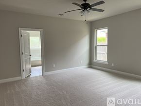 Youngsville house for rent - A room with a ceiling fan and a window.
