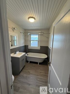 Morgantown apartment for rent - A room with a bed, a desk, and a bookshelf.