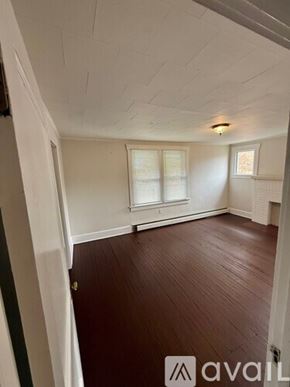 Morgantown apartment for rent - A storage room with various items and a fan.