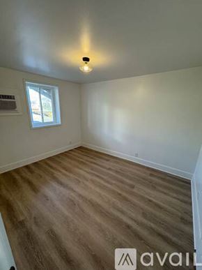 Nashville apartment for rent - A room with wooden flooring and a window.