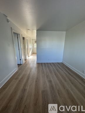 Nashville apartment for rent - A hallway with wood flooring and white walls.