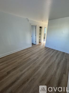Nashville apartment for rent - A room with wooden flooring and white walls.