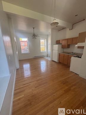 Albany apartment for rent - A room with wooden floors and white walls.