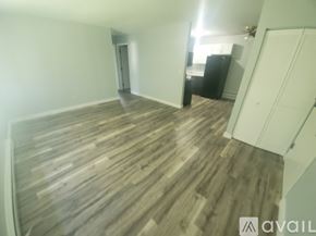 La Crosse apartment for rent - A room with wooden flooring and a white door.