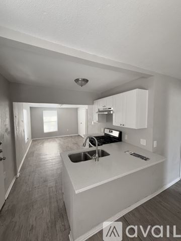 San Antonio house for rent - A kitchen with a sink and cabinets.