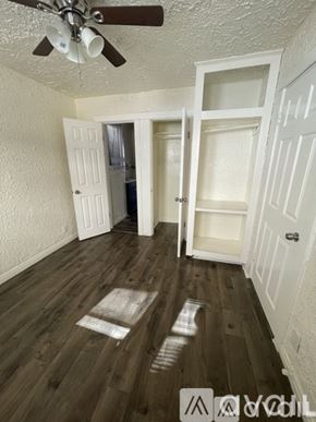 Los Angeles townhouse for rent - A room with a ceiling fan and wooden floors.