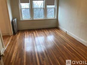 Boston apartment for rent - A room with wooden flooring and a window.